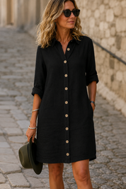 Adela vestito midi donna con abbottonatura frontale su sfondo neutro