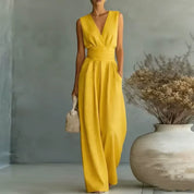 Jumpsuit donna senza maniche bianca con gamba larga, dettaglio vita