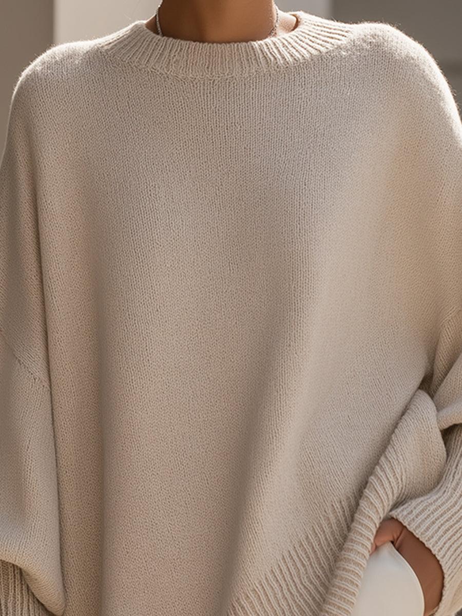 Dettaglio orlo asimmetrico poncho maglia misto poliestere e lana