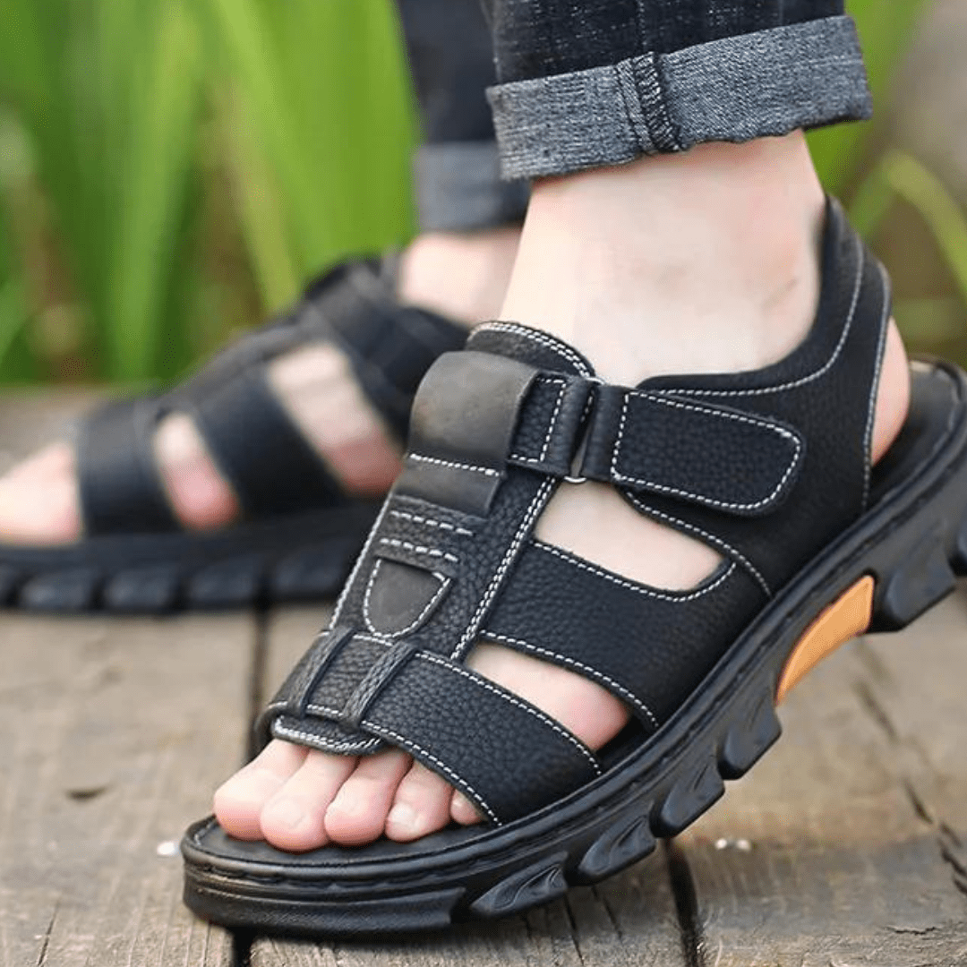 Sandali uomo in pelle nera con supporto arco plantare vista laterale