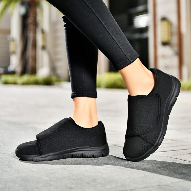 Scarpe ortopediche donna per piedi gonfi in colore nero, vista laterale